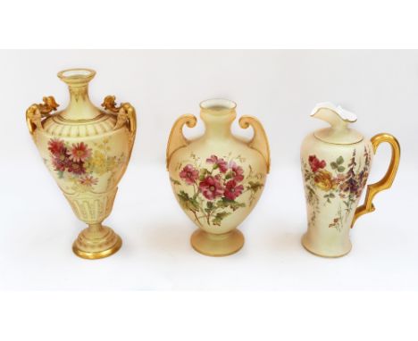 A Royal Worcester blush ivory urn-shaped vase, no. 1674 with flowers, approximately 28cm high; a rounder Royal Worcester blus