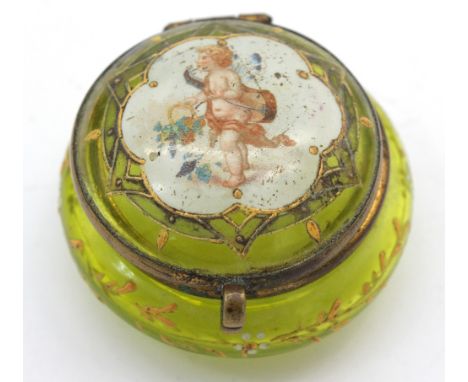 A 19th century pale green glass trinket pot, of circular form with enamelled overlay of flowers and foliage, metal hinged cov
