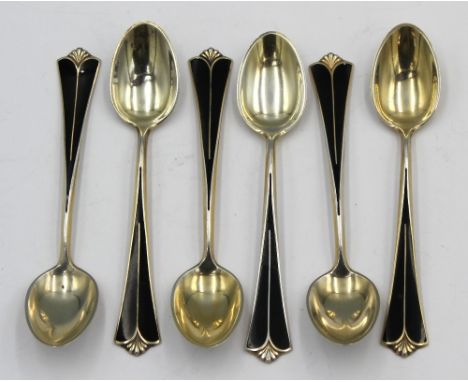 A set of six 20th century Norwegian silver gilt and enamel coffee spoons, all with Art Deco style black enamel stems to termi