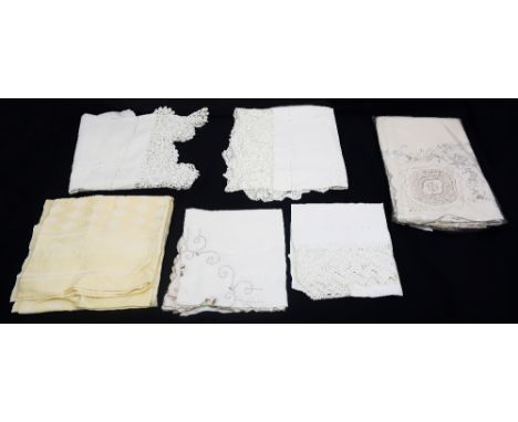 A collection of white wear to include late Edwardian and early 1920/30s white tablecloth with cream pattern, 1930s/40s cloth 