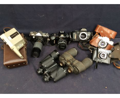 A collection of cameras to include; a Praktica Super TL, a Cosmic 35, a Ternit USSR; a Nikon camera with lens and one without