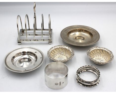 A collection of silver to include; an Edwardian silver four division toast rack, hallmarked by William Hutton & Sons, London,