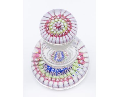 A Victorian Old English glass inkwell, with a central red / white cog cane, with six rings of white and red then blue and whi