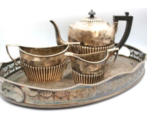 A Victorian silver three piece tea set, all of oval partly gadrooned shape, tea pot with ebonised handle and finial, hallmark