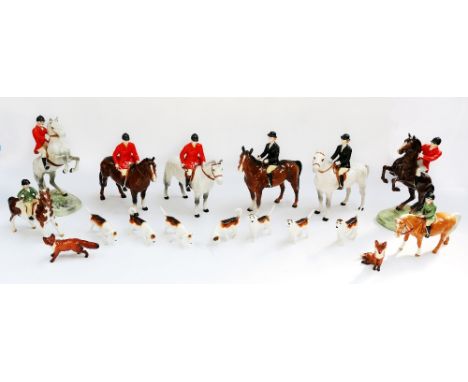 A mid 20th Century Beswick hunting set , to include a Huntsman figure on Brown horse, model 1501, a Huntsman figure on Grey h