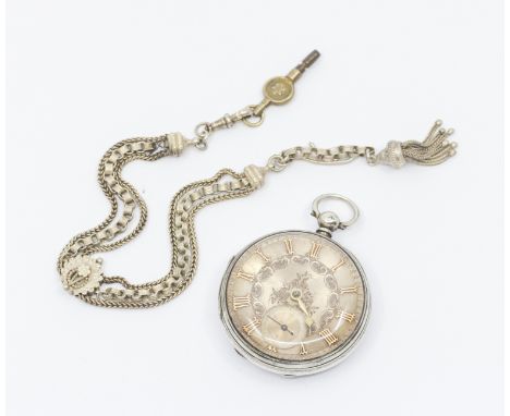 A Victorian silver cased key wind open faced pocket watch, comprising a silvered dial with applied gilt numeral markers, foli