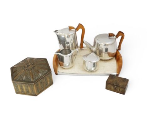 A Picquot Ware tea set along with a hexagonal Eastern brass box decorated heavily with foliage and central bird, and a small 