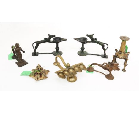 Assorted Indian brass items comprising a four legged Kohl terminating in circular pad feet, 13cm high; Indian brass Hindu lam