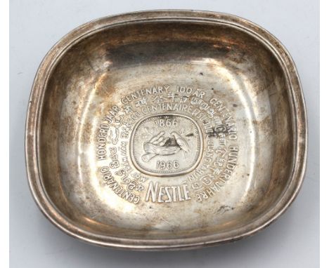An Elizabeth II silver curved bowl, with embossed inscription commemorating the centenary of Nestle 1866 - 1966, hallmarked b