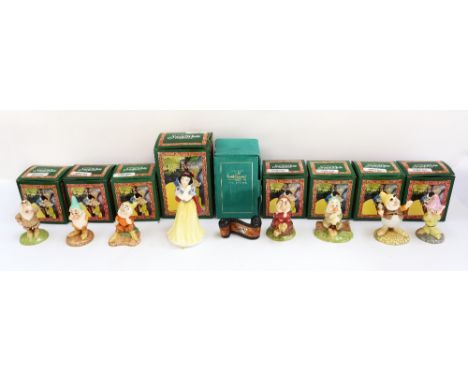 A set of Snow White figures by Royal Doulton to include, Snow White, Happy, Grumpy, Sleepy, Bashful, Doc, Sneezy & Dopey , to