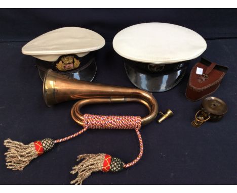 A TC Co Ltd London MKII cased compass and, military bugle and two naval caps.