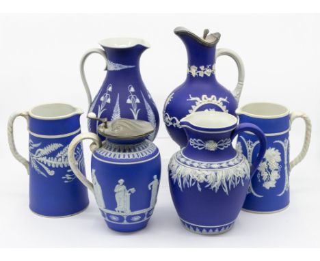 A selection of six blue and white Dudson pottery (all not stamped Dudson) jugs, two with either pewter or plated covers, vary