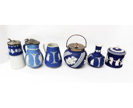A collection of mixed Dudson (only one piece stamped Dudson) blue ground ceramics, consisting of three jugs, a barrel with pl