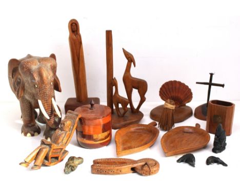 A collection of wooden treen items to include large African carved elephant, figures, nut cracker, dishes etc.