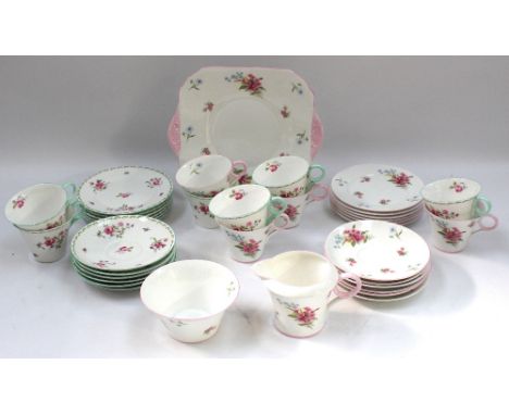 Shelley - a part tea set consisting of four cups, six saucers, six side plates, milk jug and sandwich plate, all in pink bord