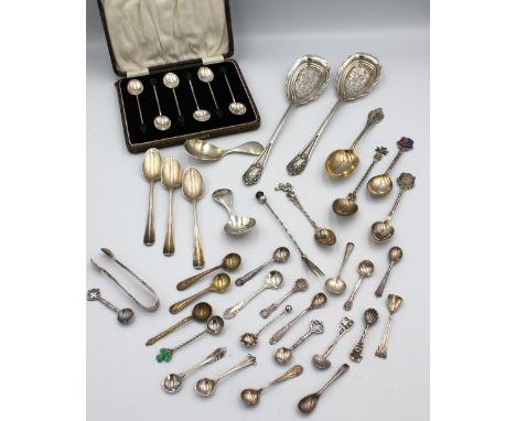 A collection of mixed silver flatware to include; two similar Modernist silver caddy spoons, both hallmarked by Brian Leslie 