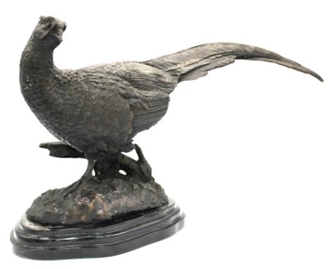 After Jules Moigniez (1835-1894, French); a bronze sculpture of a pheasant set in a naturalistic setting, raised on a black m