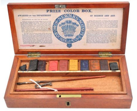 An early 20th century Newman mahogany cased paint box, with removable tray holding various paints with crown cyphers and pain