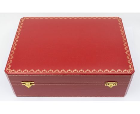 A large Parfums de Cartier Paris red leatherette box with satin cushion to interior. Approx. 12in x 8.5in x 4in. Signs of use
