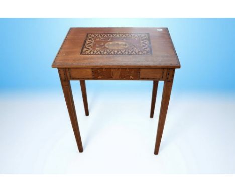 A 19th century Irish Killarney inlaid marquetry and Yew games table, the top inlaid with a church and shamrock leaf decoratio