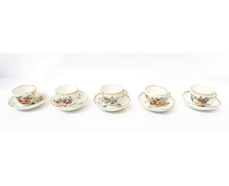A set of six 19th century, possibly Meissen cups and saucers, with entwined handles, hand painted with flowers and insects, e