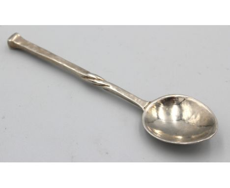 Omar Ramsden; a George V silver coffee spoon, with twisted stem leading to nail top terminal and planished design, hallmarked