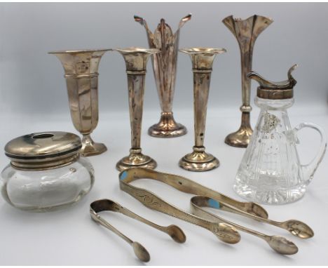 A collection of silver comprising: an Elizabeth II silver whisky noggin, with cut glass body and handle with hinged silver to