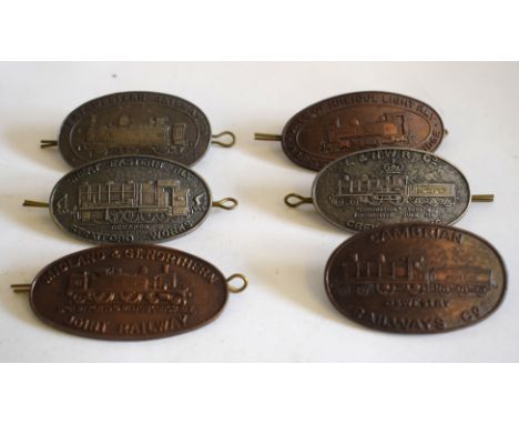 Six modern metal oval railway-interest collectors’ Badges with loops and split pins (1 pin missing) depicting locomotives: GE