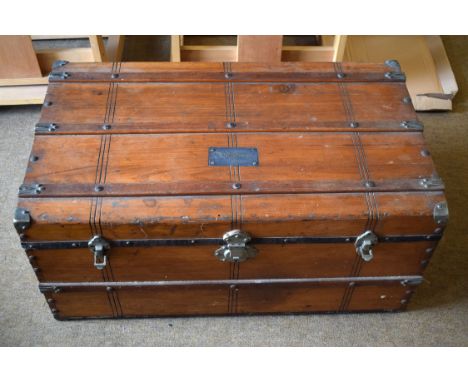 Sturdy wooden trunk 82 x 48 x 38cm, nameplate ‘S.P. Elliott’ on top. No key.