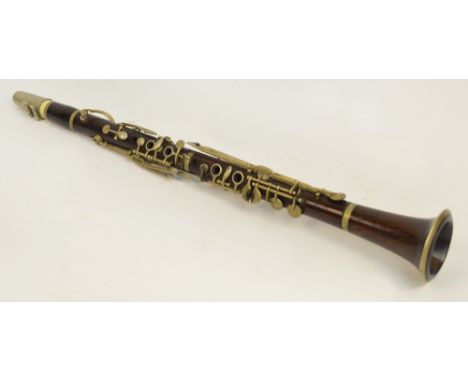 An early 20th century Cabart rosewood B flat clarinet, unboxed.