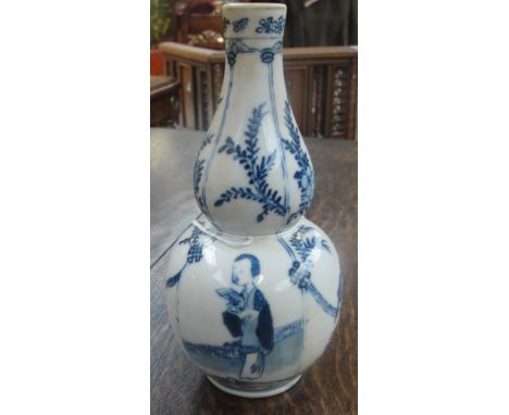 A 19th century Chinese porcelain double gourd vase painted in underglaze blue with figures and birds, bears underglaze blue f