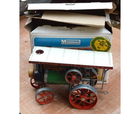 A boxed Mamod steam tractor.