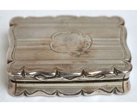 An Victorian hallmarked silver shaped rectangular snuff box with engine turned decoration and scroll framed cartouche, Birmin