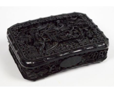 An early 19th century Chinese Canton tortoiseshell curved rectangular snuff box, finely carved throughout, the hinged lid dec