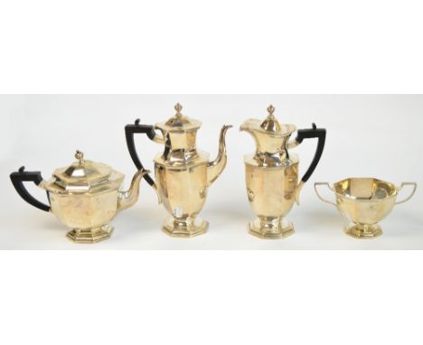 A George V hallmarked silver four piece tea service comprising a teapot of squat octagonal form, raised on spreading foot, a 