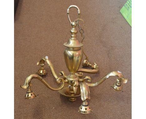 An early 20th century brass five branch pendant light with five ribbed clear glass shades, height of light fitting 58cm.