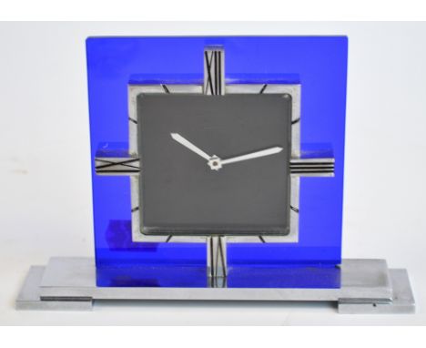 An Art Deco chrome and blue glass mantle timepiece, the square dial inscribed "Mappin", the stepped rectangular base inscribe