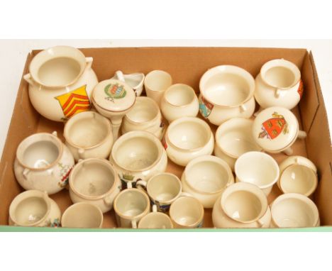 A collection of crested china including WH Goss cauldrons etc.