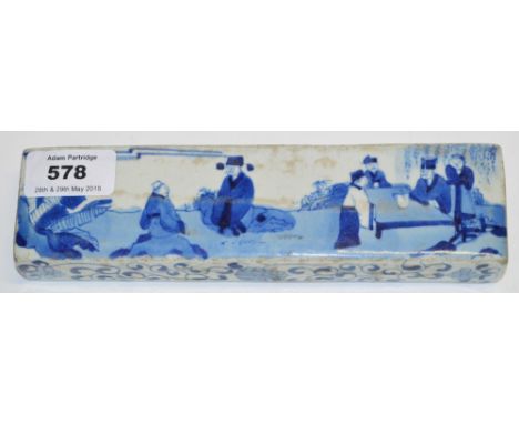 A decorative 20th century Chinese porcelain rectangular scroll weight, painted in underglaze blue with officials in a garden 