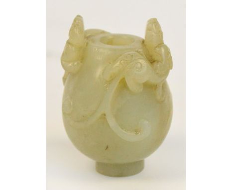 A 19th century Chinese pale green jade snuff bottle, carved with two chilong dragons with straight circular foot, height 5.5c