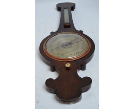 An early 19th century mahogany banjo barometer/thermometer, the circular silvered dial inscribed Burn & Son, Epsom, with ivor