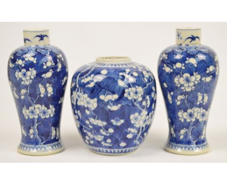 A 19th century Chinese porcelain jar painted in underglaze blue with prunus, bears underglaze blue four character Kangxi mark