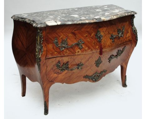 A French kingwood and tulipwood bombe commode, the serpentine marble top above two drawers with ornate gilt handles, foliate 