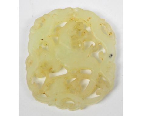 An early 20th century Chinese pale green jade open work plaque, carved and pierced with a phoenix and two chilong dragons, 5.