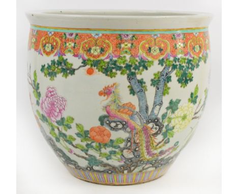 A large 19th century Chinese porcelain jardinière hand painted in Famille Rose enamels with exotic birds amongst floral spray
