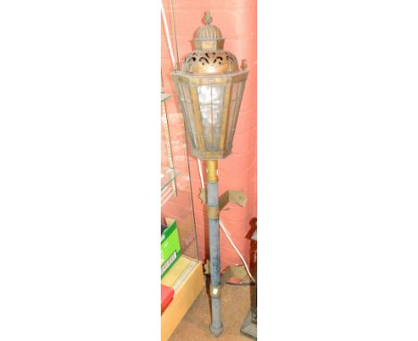 An early 20th century wall mounted light in the form of a street lamp, height 131cm.