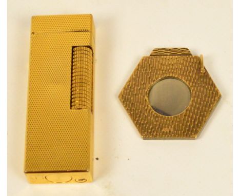 A 9ct gold steel bladed textured cigar cutter of hexagonal form, diameter 3.5cm, and a gold plated Dunhill textured rectangul