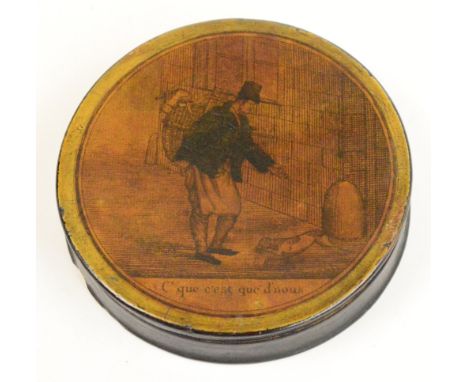A mid 19th century circular French snuff box with print to lid of a ratcatcher and a dog, diameter 8.5cm.