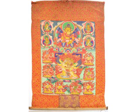 A 19th century Tibetan thangka, centred with Chaturbhujia Mahakala, with skull cup in his front left hand backed by Aureole o