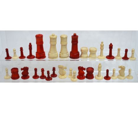 *Amended Description* A collection of turned bone and stained bone chess pieces, height of king 6.5cm, the larger pieces holl